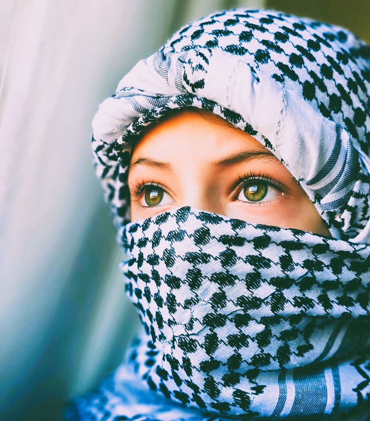 A folded black-and-white Palestinian keffiyeh